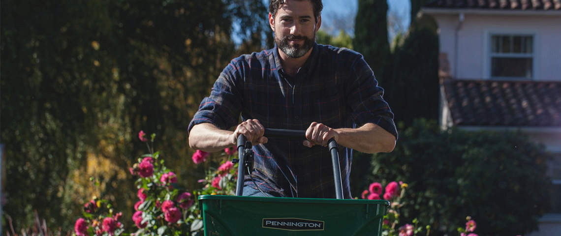 Man with pennington grass seed